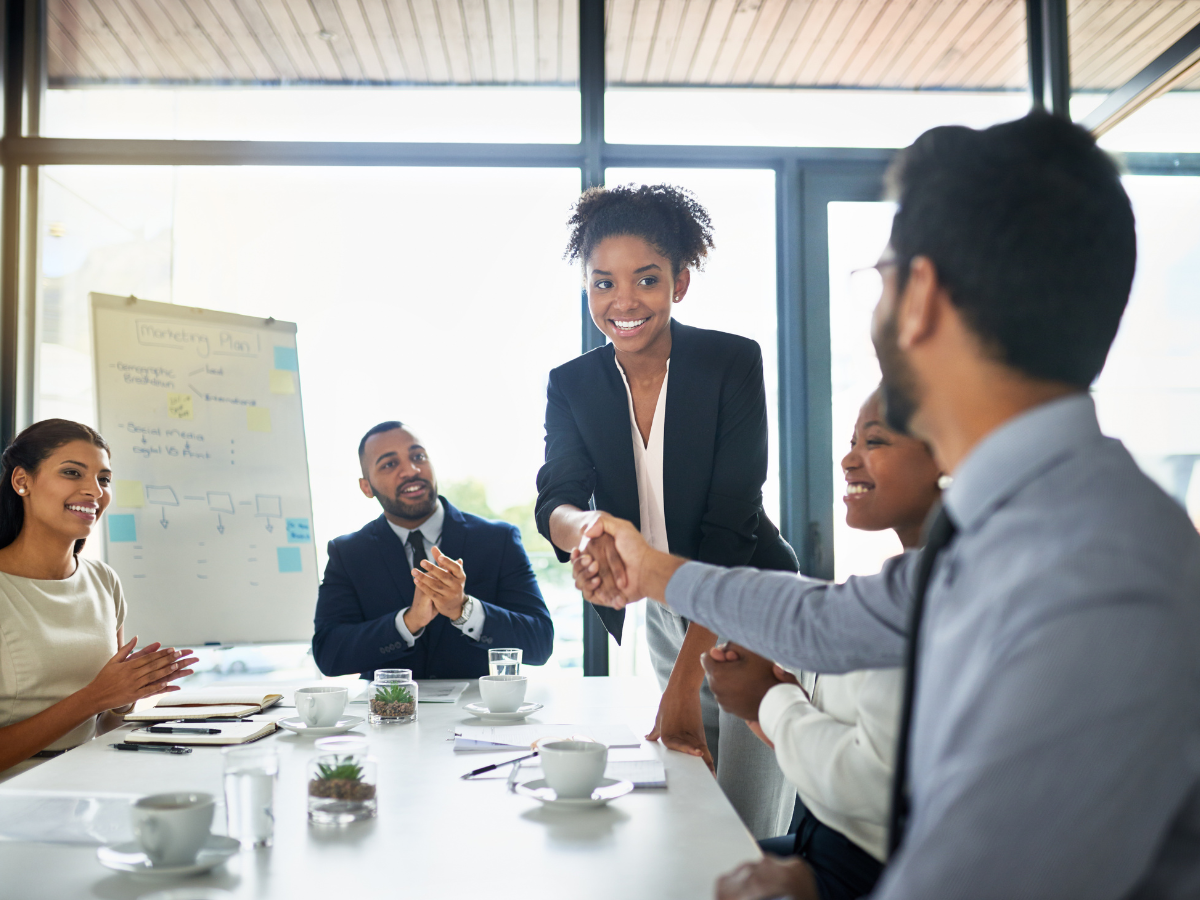 employees giving recognition to co-worker